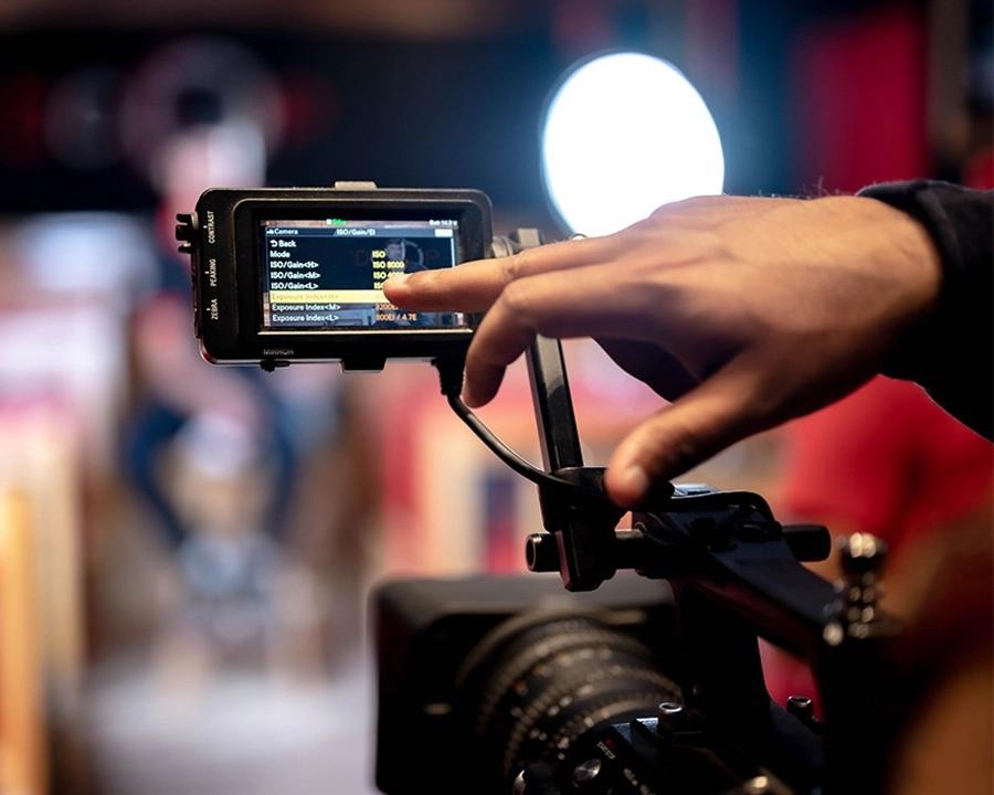 Close-up of a cinema camera monitor being configured during a pre-production and storytelling session