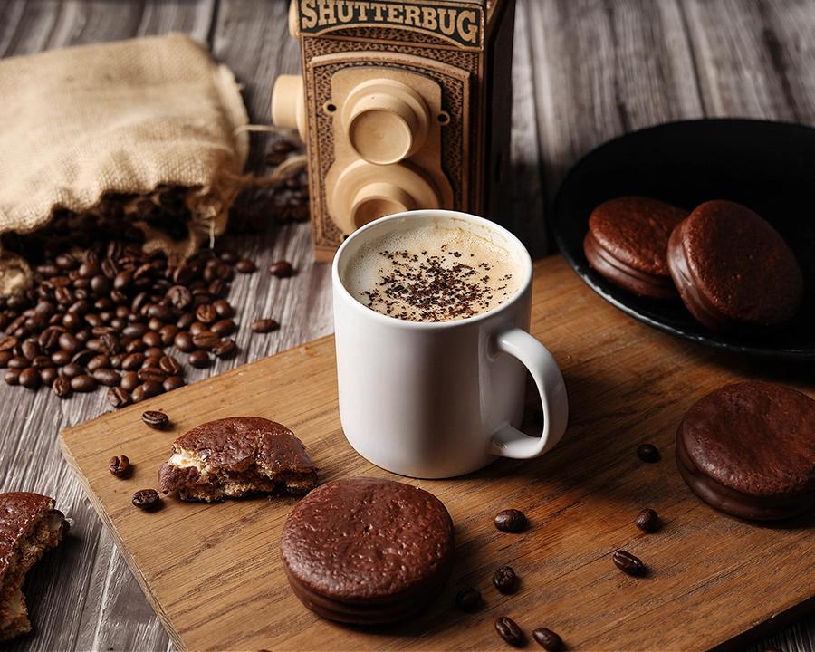 Styled coffee and chocolate biscuit composition created for food and beverage photography