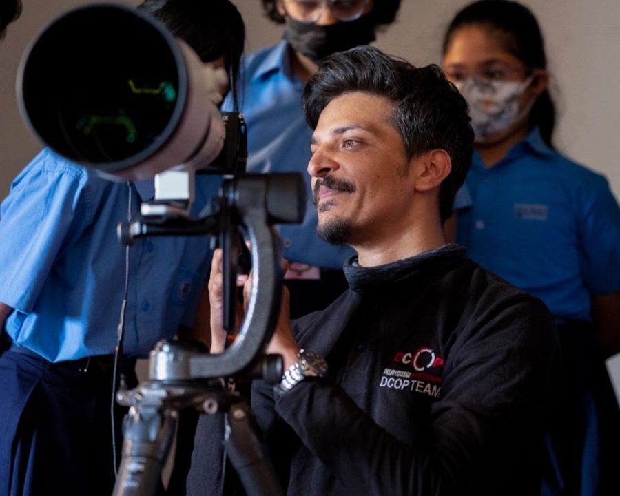 DCOP instructor demonstrating camera functions, colour and focus with a telephoto lens
