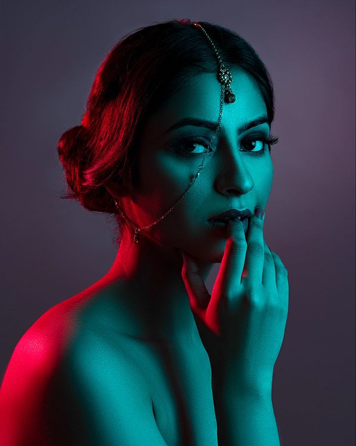 Fashion portrait created with red and cyan commercial studio lighting