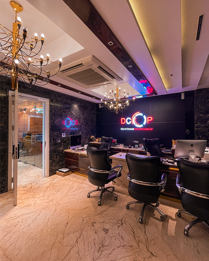 DCOP head office with workstations, meeting chairs and illuminated college branding