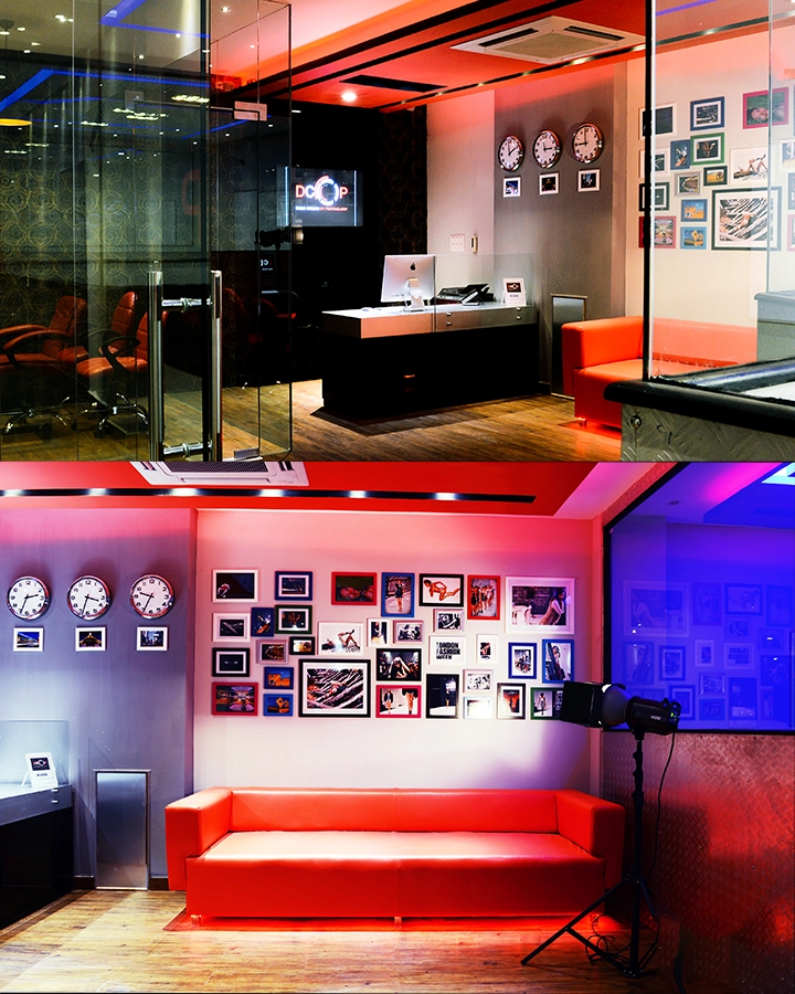 DCOP reception desk and waiting area with red seating and framed photographs