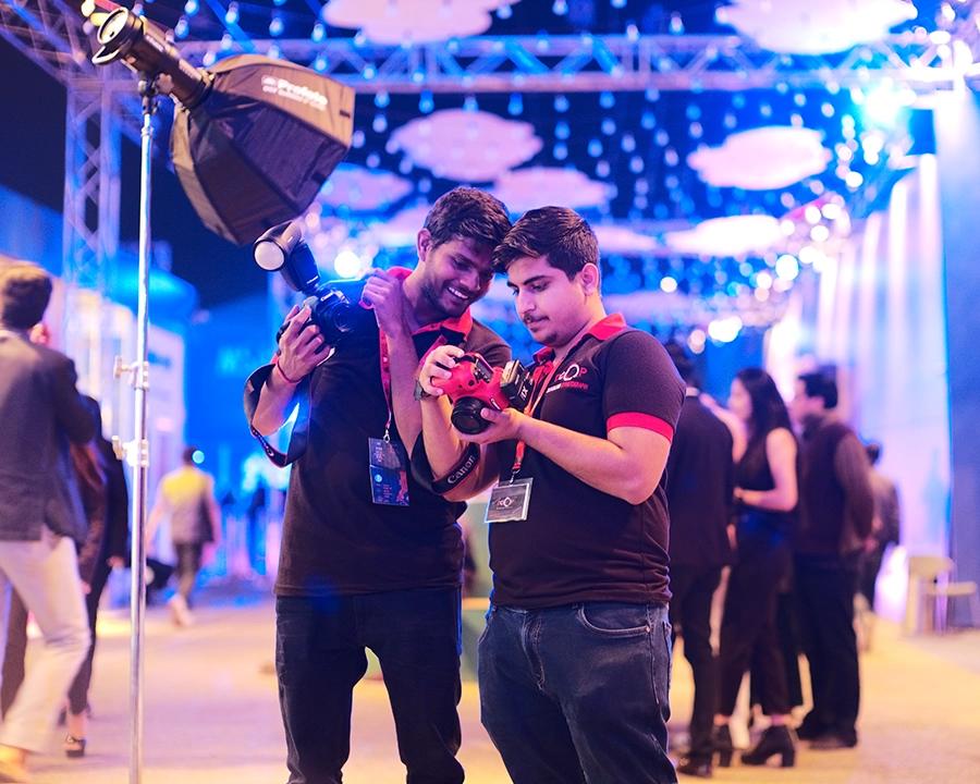 DCOP students reviewing photographs during a live event